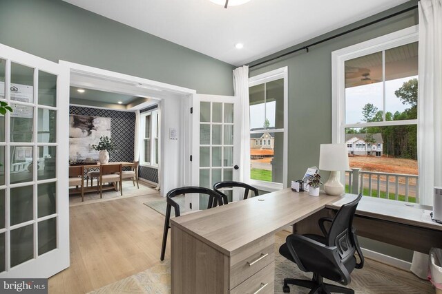 office space featuring light wood-type flooring and french doors