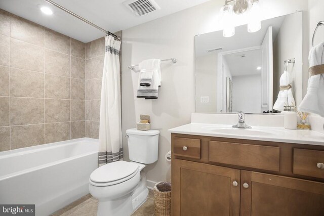 full bathroom featuring vanity, toilet, and shower / bath combo with shower curtain