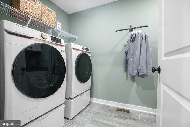 washroom featuring separate washer and dryer