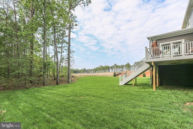 view of yard with a wooden deck