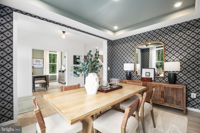 dining space with light hardwood / wood-style flooring