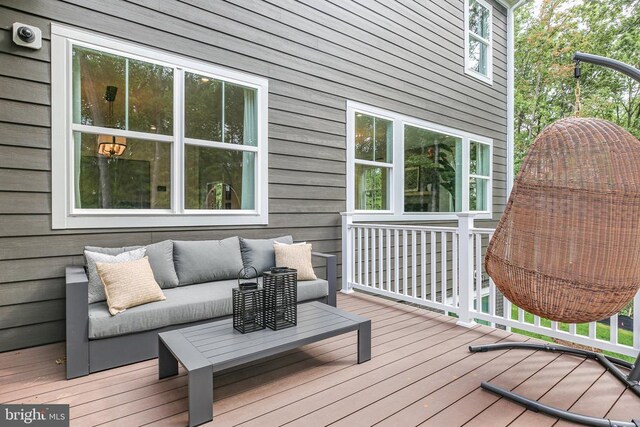 wooden terrace featuring an outdoor hangout area