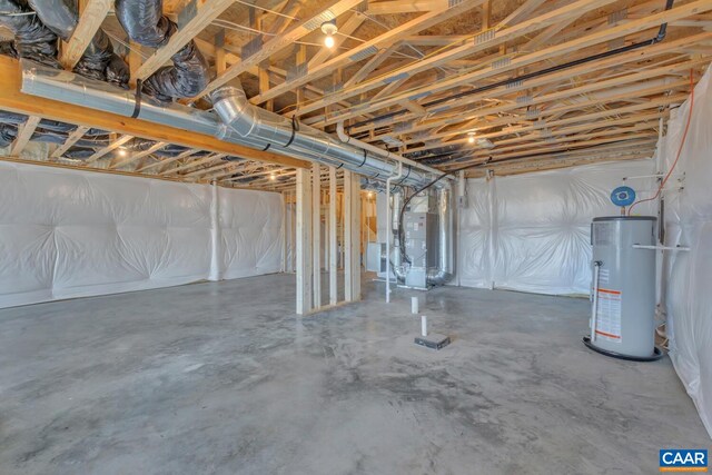 unfinished basement featuring gas water heater and heating unit