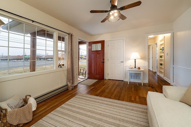 foyer featuring a baseboard radiator and dark hardwood / wood-style flooring