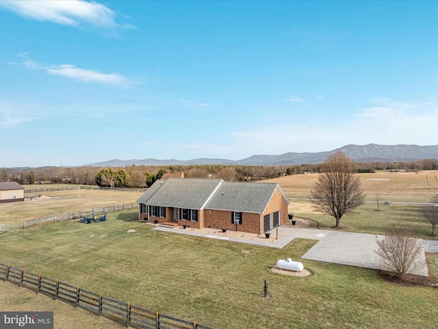 bird's eye view featuring a rural view and a mountain view