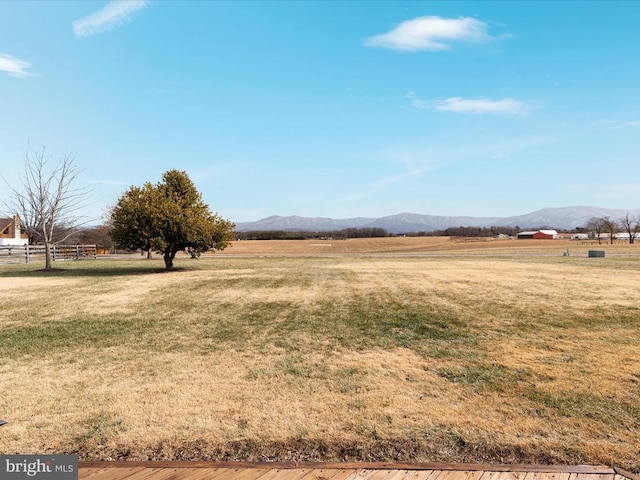 view of yard featuring a mountain view and a rural view