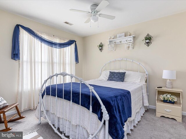 carpeted bedroom featuring ceiling fan