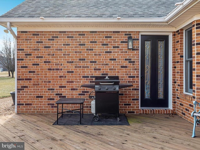 wooden deck featuring area for grilling