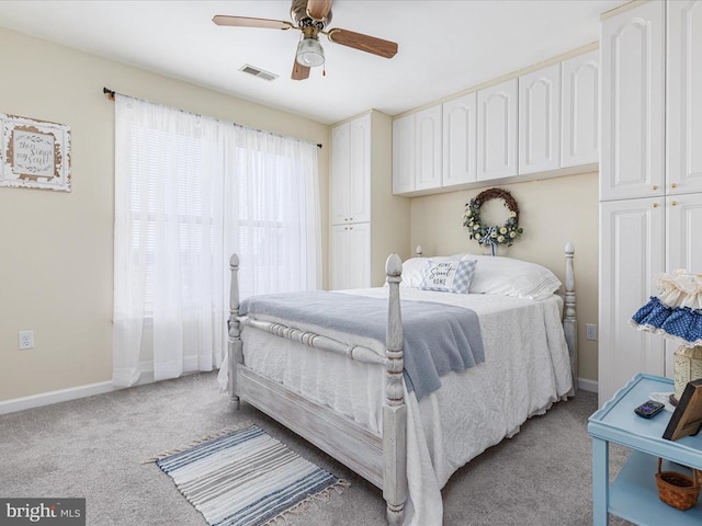 bedroom with light carpet and ceiling fan