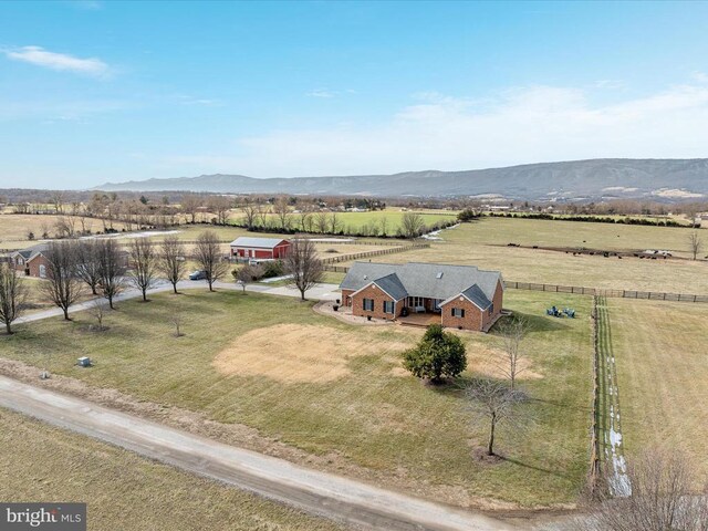 drone / aerial view featuring a rural view and a mountain view