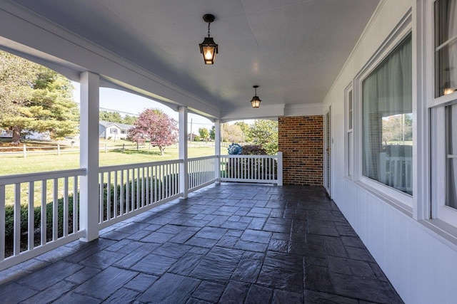 wooden terrace featuring covered porch