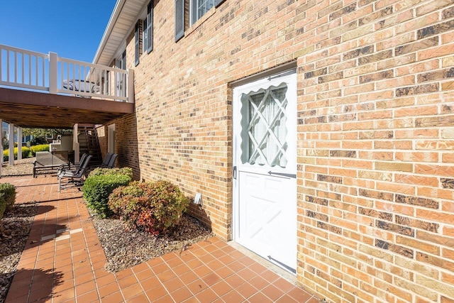 entrance to property featuring a patio