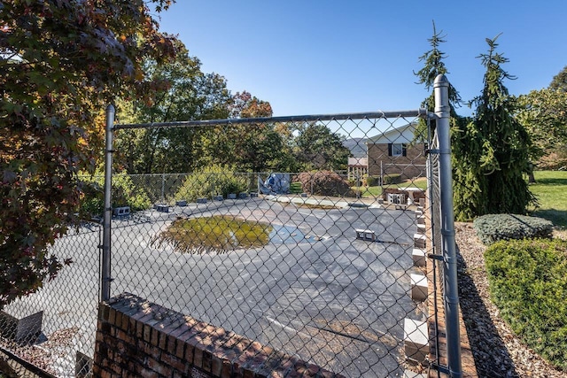 view of community featuring basketball court