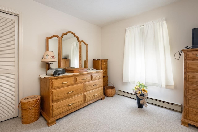 living area with a baseboard radiator and light colored carpet