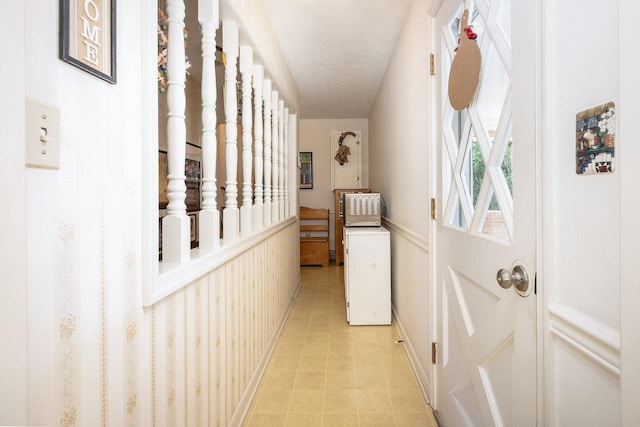 hallway featuring a textured ceiling