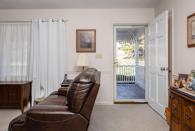 sitting room with light colored carpet