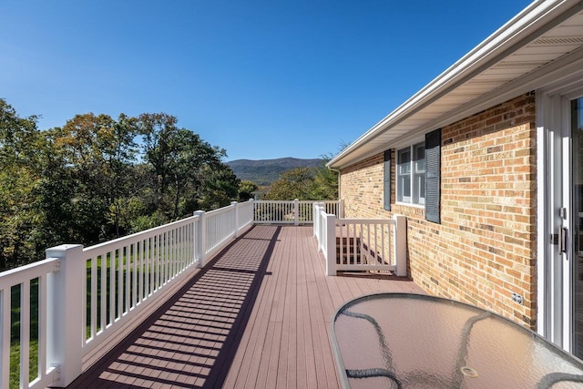 wooden terrace with a mountain view