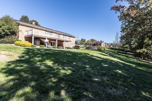 view of yard with a wooden deck