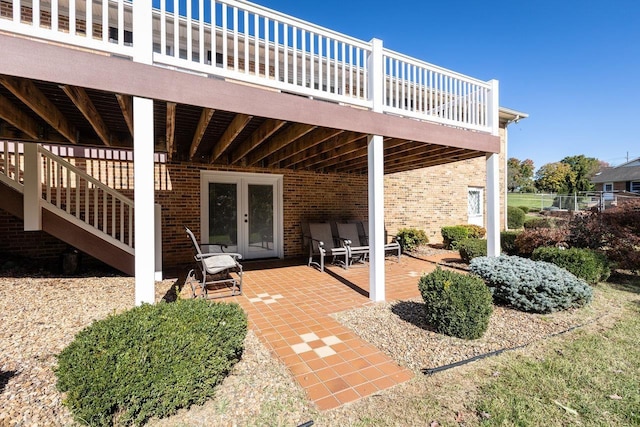 view of patio featuring french doors and a deck