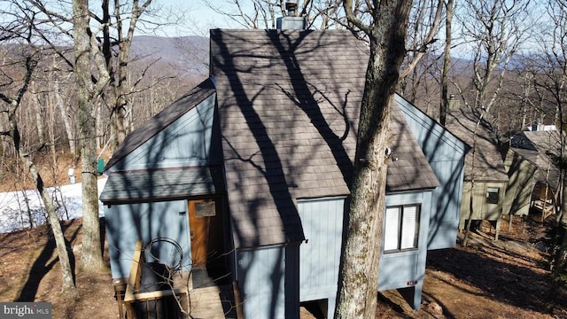 view of side of home featuring a mountain view