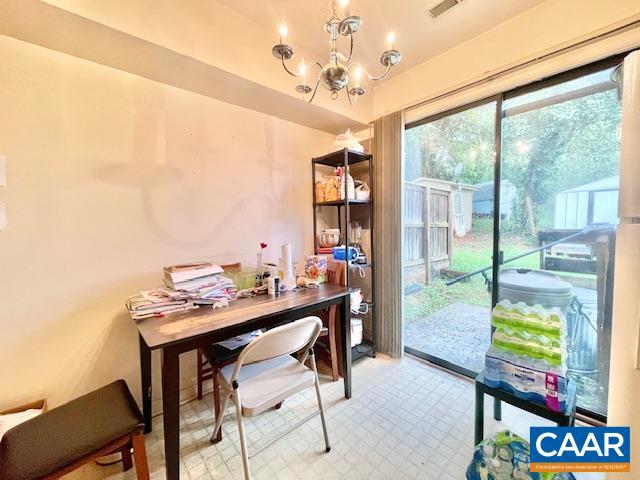 office area featuring a notable chandelier