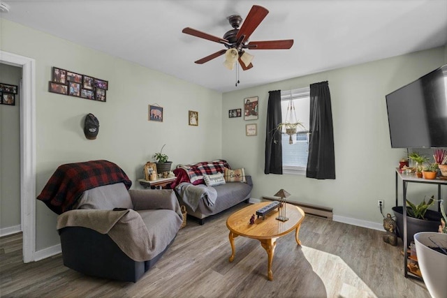 living room featuring ceiling fan, hardwood / wood-style floors, and baseboard heating