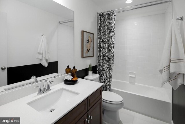 full bathroom featuring shower / bath combination with curtain, tile patterned floors, vanity, and toilet