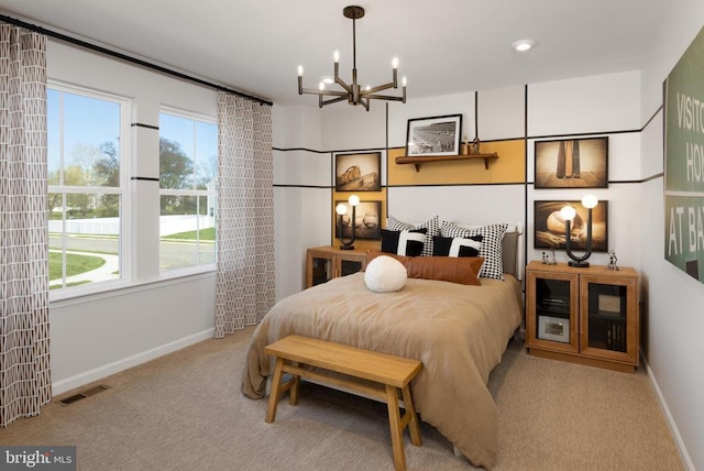 bedroom featuring light colored carpet and an inviting chandelier