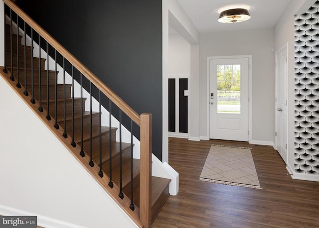 entrance foyer with dark hardwood / wood-style floors