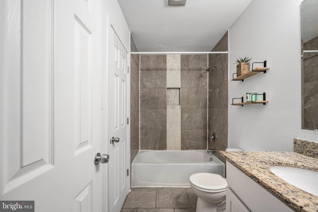 full bath featuring shower / bathing tub combination, tile patterned flooring, vanity, and toilet