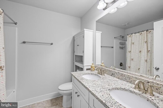 full bathroom with shower / bath combination with curtain, vanity, toilet, and tile patterned flooring