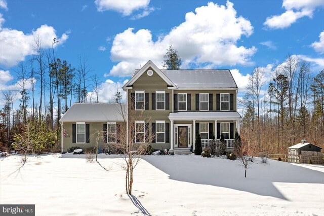 colonial home featuring covered porch