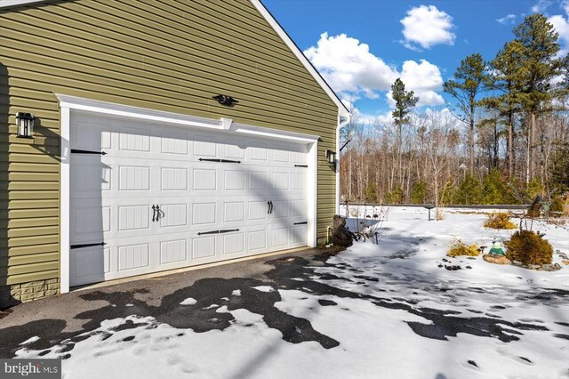 view of snow covered garage