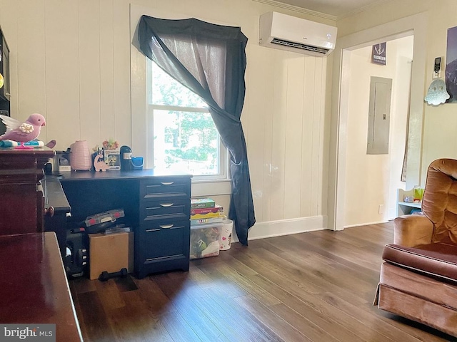 interior space with a wall unit AC, wood finished floors, electric panel, and baseboards