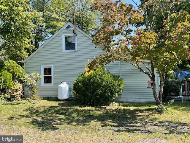 view of home's exterior featuring a lawn