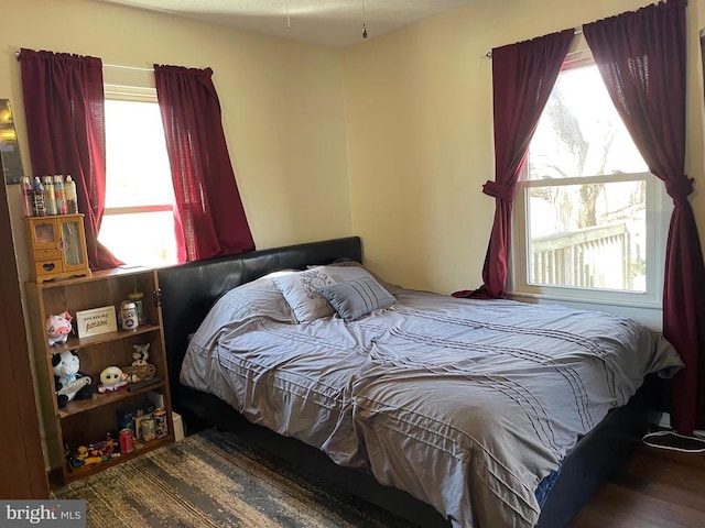 bedroom with wood finished floors