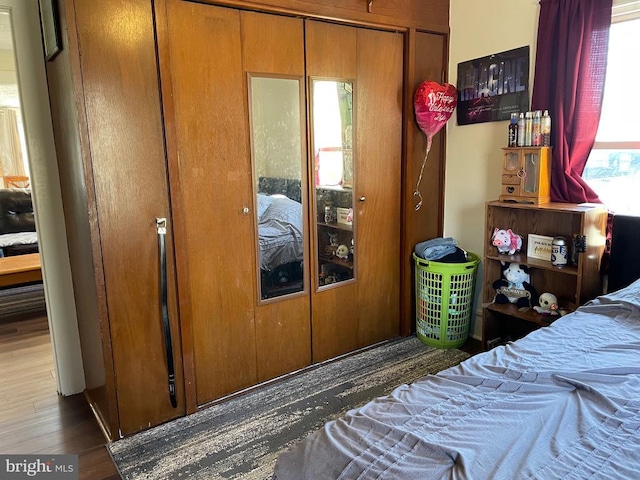 bedroom with wood finished floors