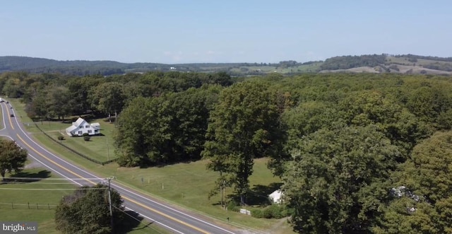 drone / aerial view with a rural view and a wooded view