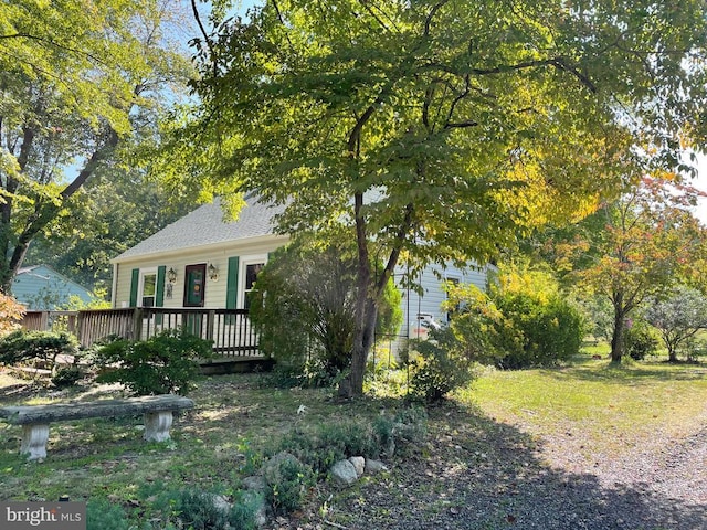 view of front of home featuring a wooden deck