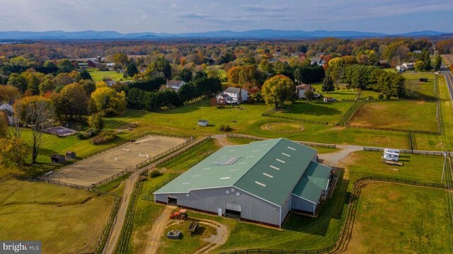 birds eye view of property featuring a mountain view