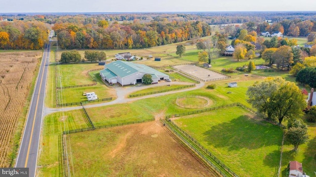 birds eye view of property with a rural view