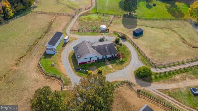 birds eye view of property featuring a rural view