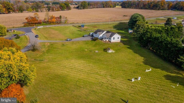 birds eye view of property with a rural view