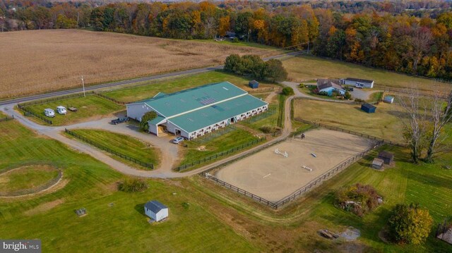 birds eye view of property with a rural view