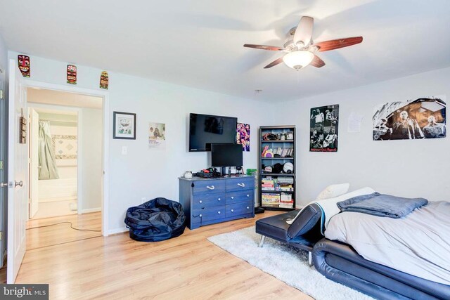 bedroom with ceiling fan and light hardwood / wood-style flooring