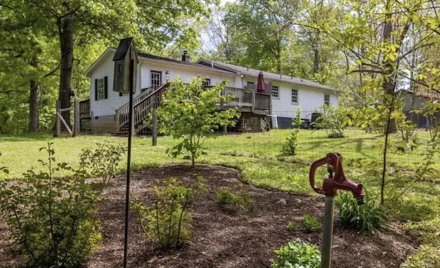 view of yard with a wooden deck