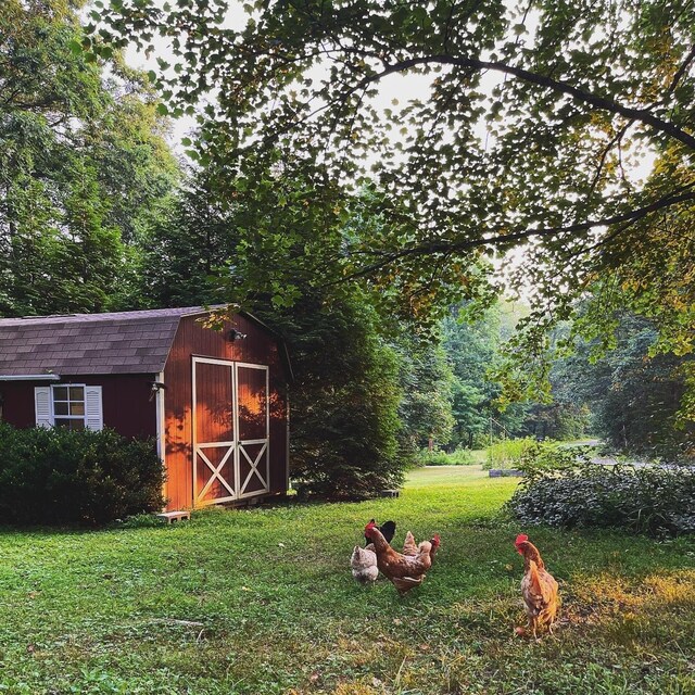 view of outdoor structure with a lawn