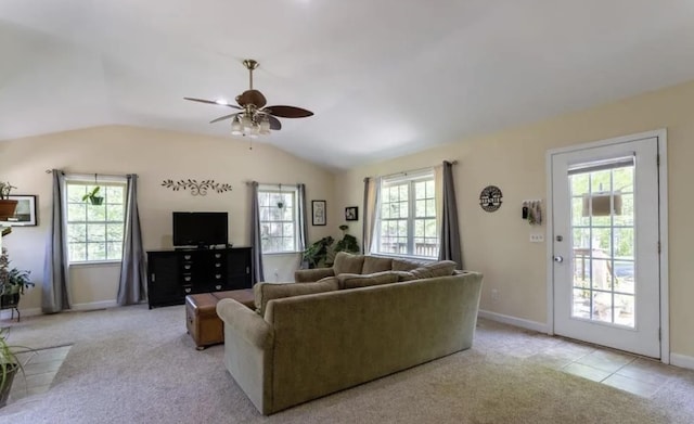 living room featuring lofted ceiling, a healthy amount of sunlight, light colored carpet, and ceiling fan