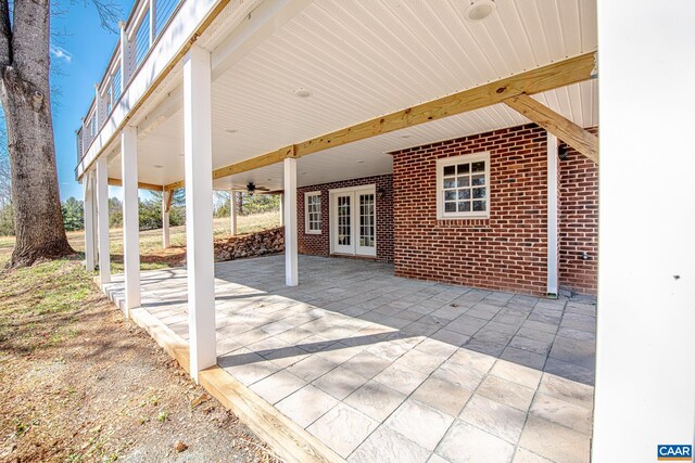 back of property with a wooden deck