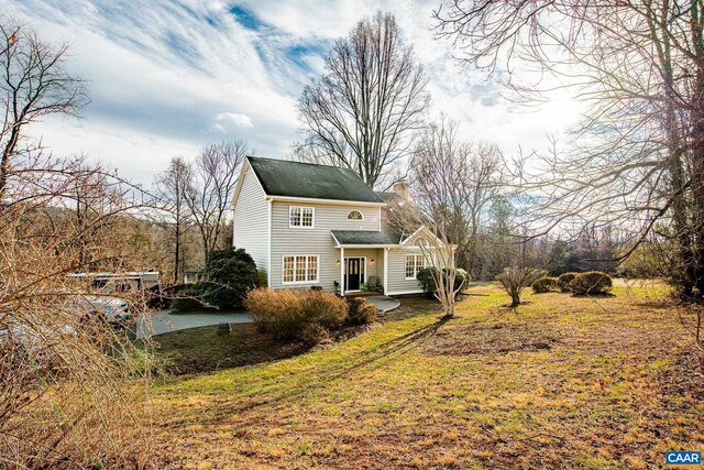 view of property with a front lawn